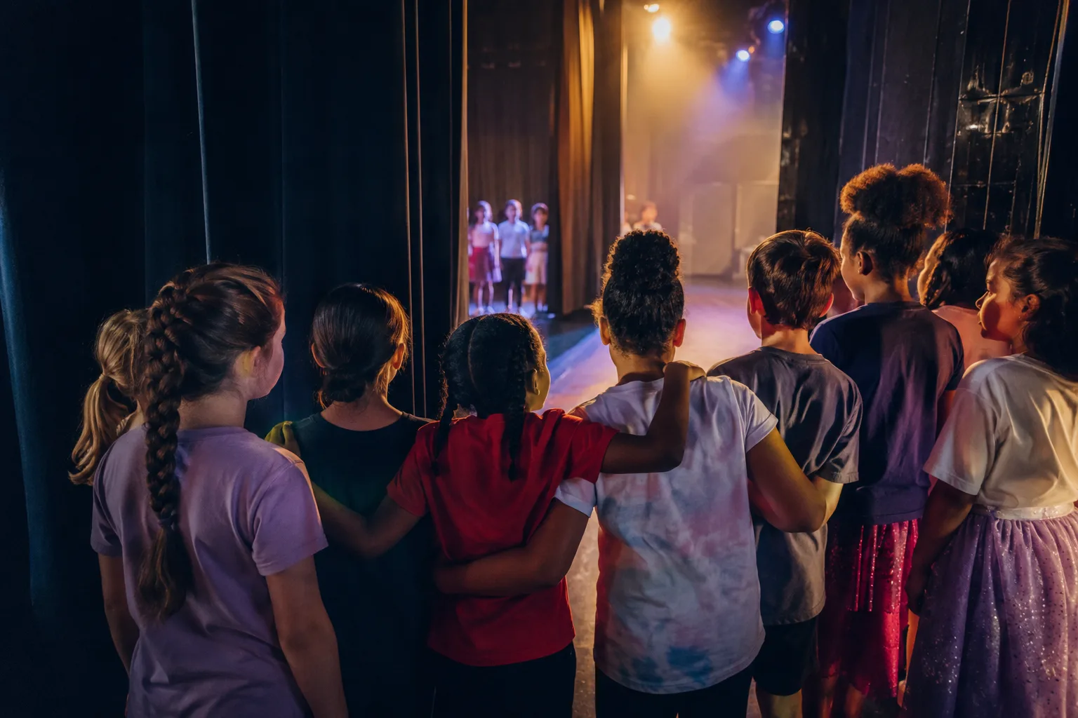 Children supporting each other while preparing to perform